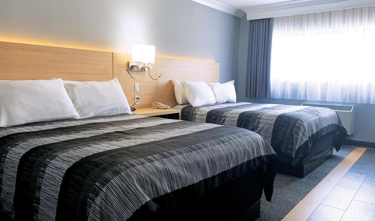 Habitación Deluxe con 2 camas grandes y acceso al parque acuático