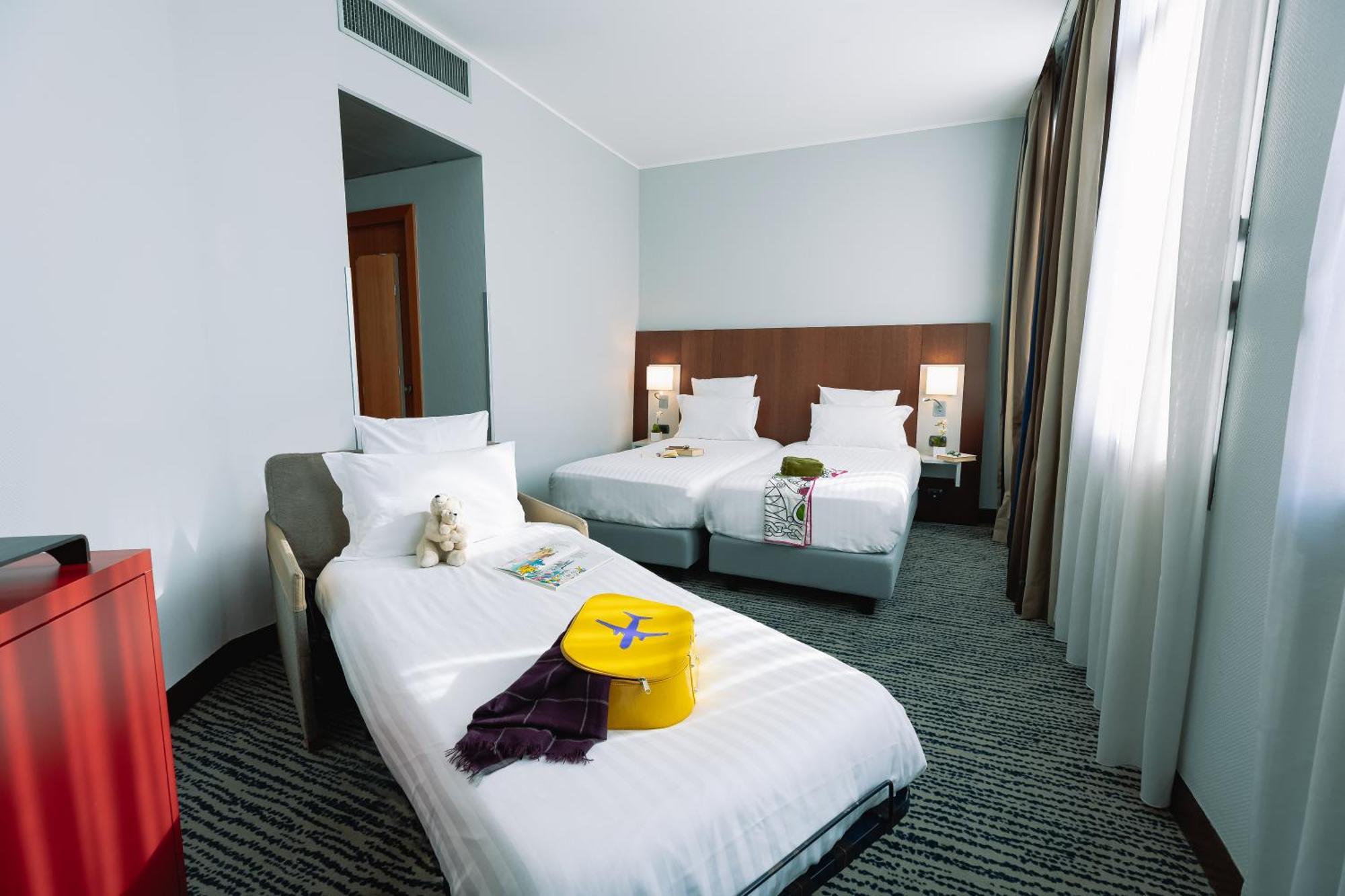 Habitación Doble Superior con 2 camas individuales y sofá cama