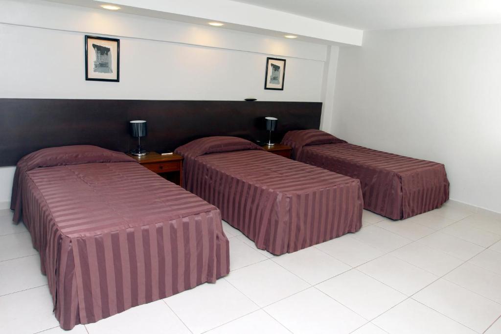 Quarto Triplo Standard (3 Camas)